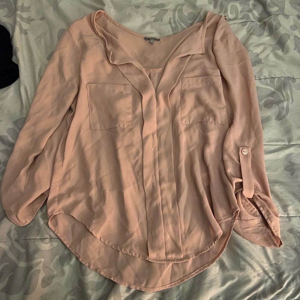 Peach colored women’s top size small.